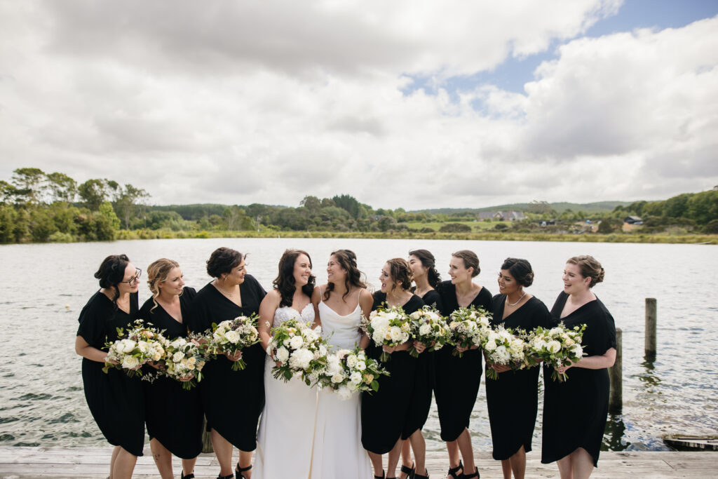Wedding with bridesmaids in front of lake