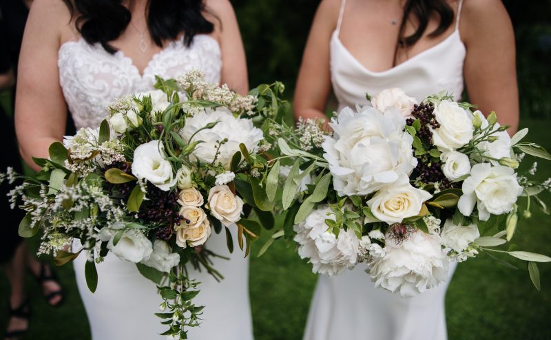 Wedding close up of flower bouquets with pink and purple flowers and greenery
