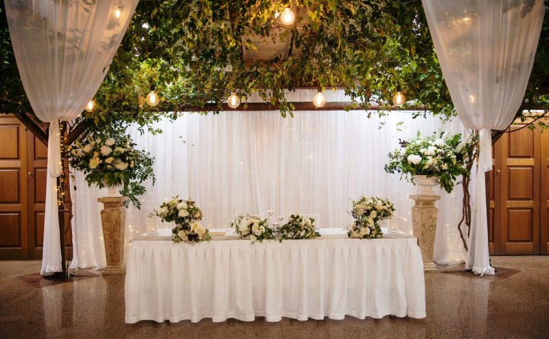 Wedding table with greenery and flowers