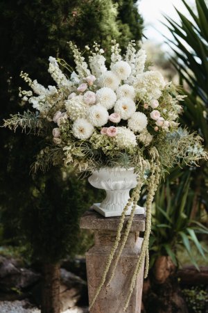 White and Pink flowers in vase with greenery