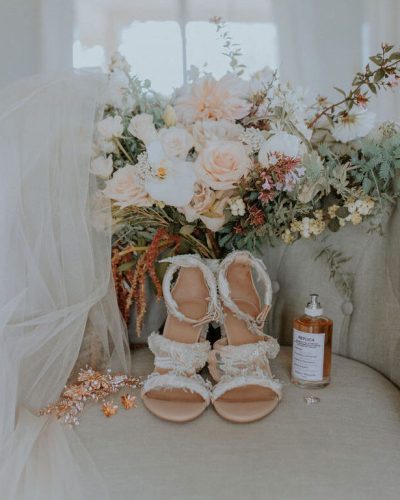 Bridal shoes photography with flowers