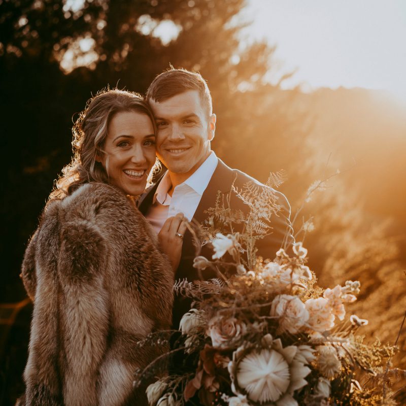 Mangawhai wedding photography with bouquet of flowers and sunset